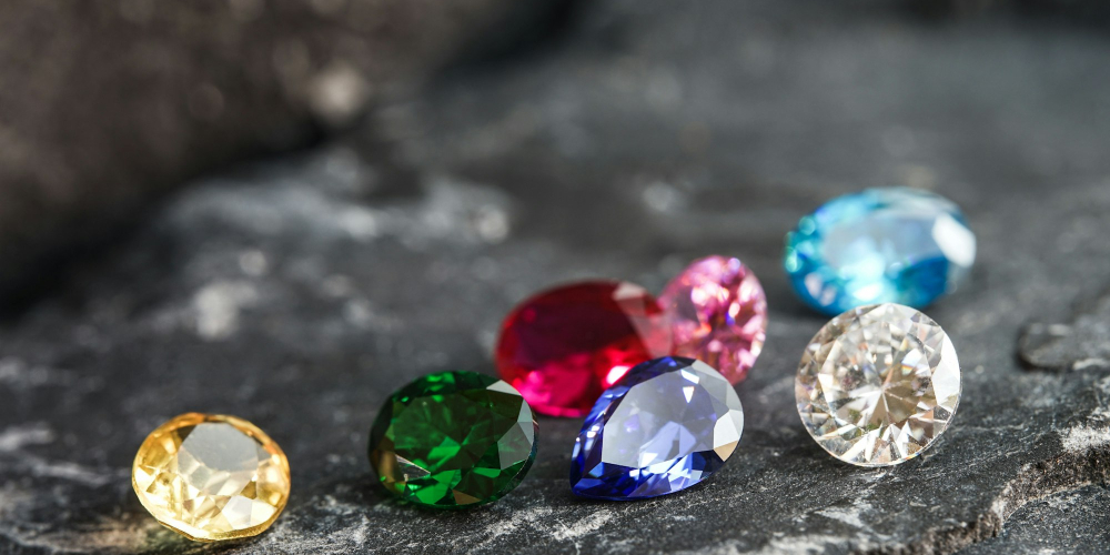 Glimmering natural colorful sapphire gemstones on a rugged rock surface